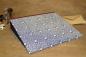 Preview: blue folder with wine-red linen edges, blue paper with ornaments in ivory, geometric, graphic pattern with dove